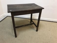 An 18th Century oak occasional table, the three plank top over a plain frieze,