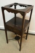 A late Victorian walnut corner whatnot, the two open shelves on turned and ringed supports,