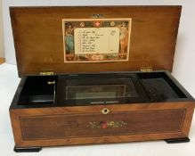 A late 19th Century Swiss rosewood and marquetry inlaid musical box with single drum playing on