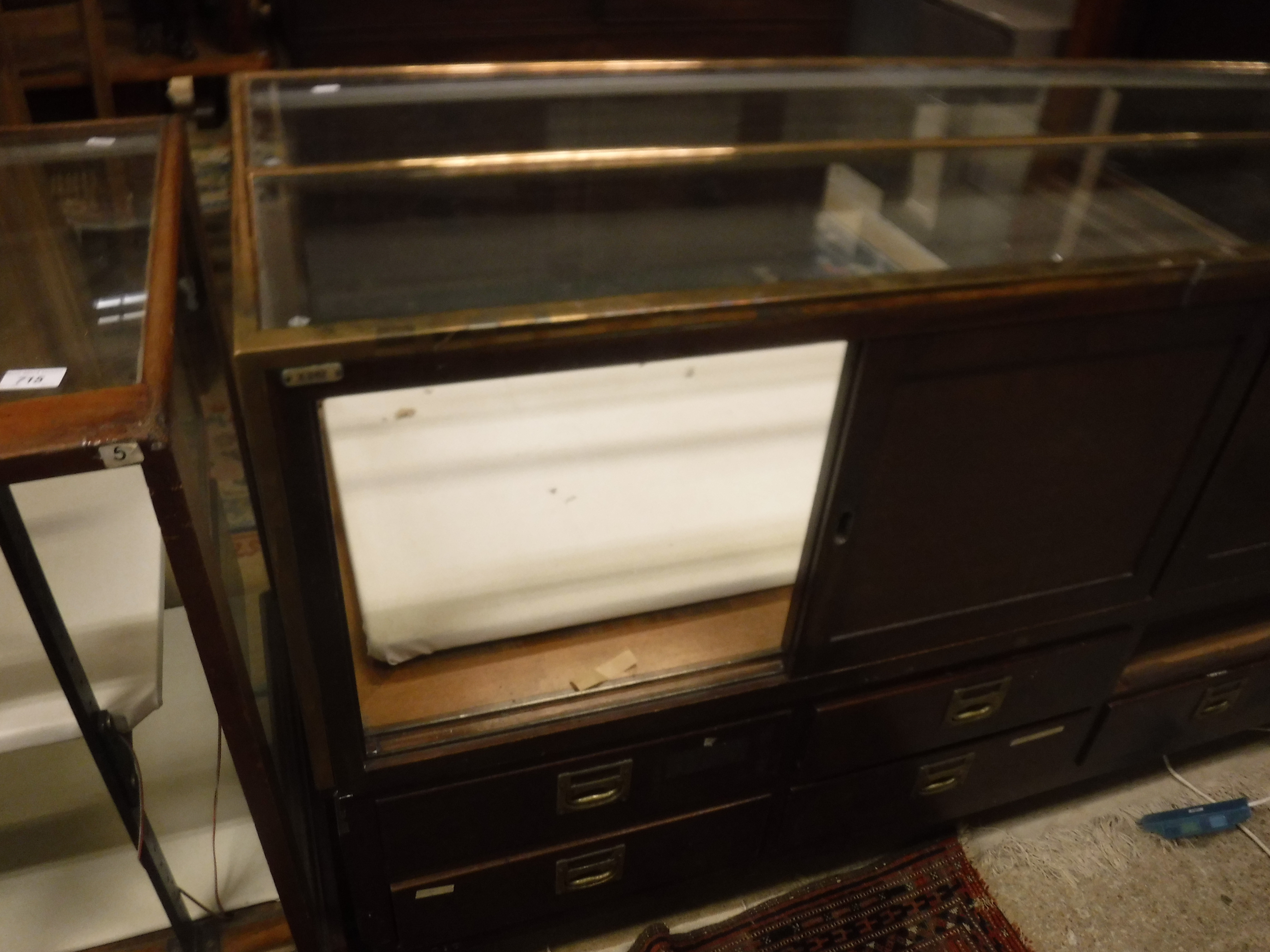 An early 20th Century brass framed and mahogany and glazed shop counter with four sliding doors - Image 7 of 11