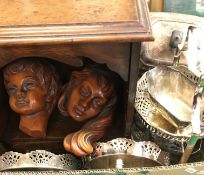 A late Victorian oak smokers cabinet with glazed door together with a pair of pottery wall masks by