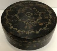 A 19th Century circular tortoiseshell and piquet work decorated box with floral wreath decoration,