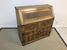 A modern oak bureau,