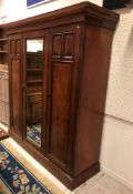 A Victorian mahogany wardrobe compactum,