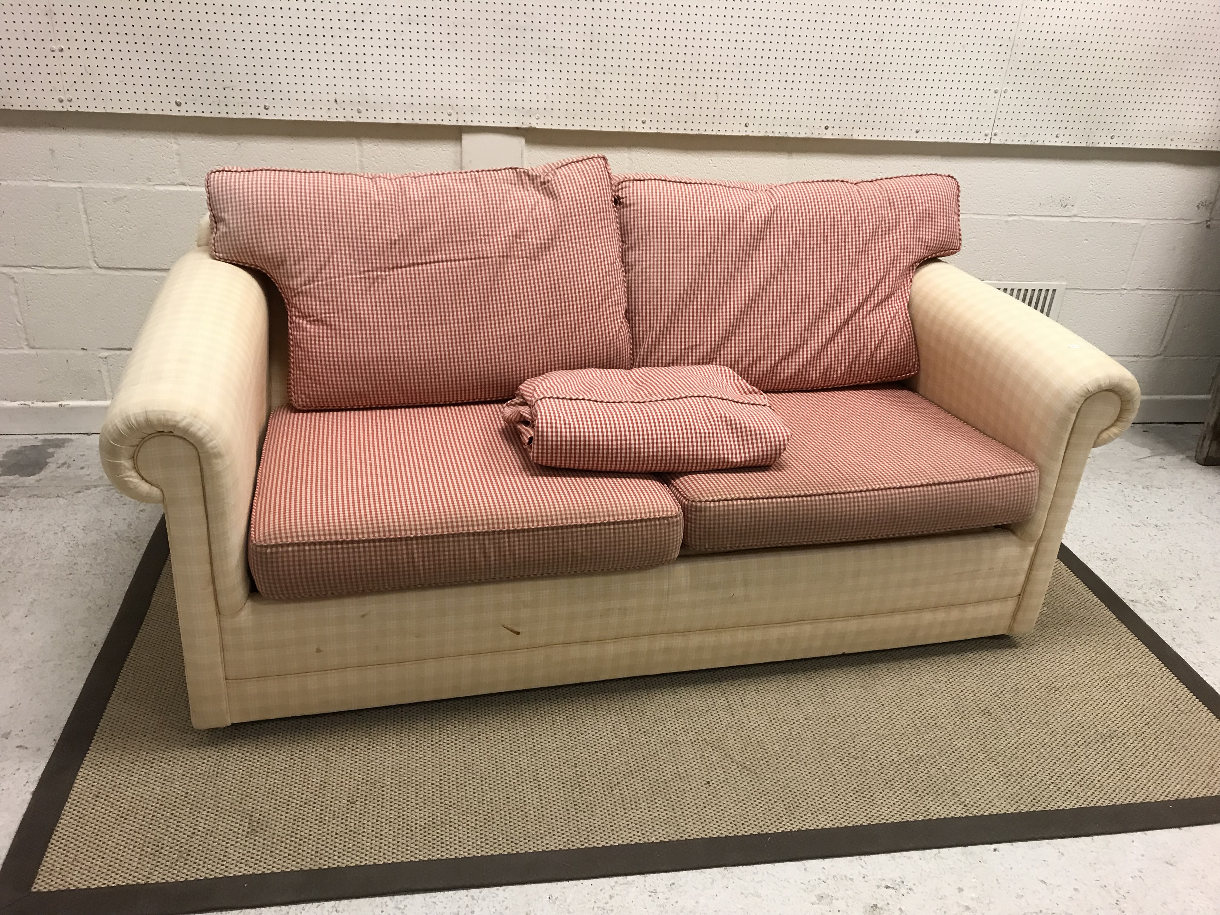 A modern check upholstered two seat scroll arm sofa,