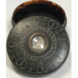 A 19th Century carved tortoiseshell circular box,