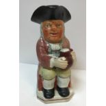 A 19th Century Staffordshire pottery Toby jug as "Toby Philipott seated with jug of ale on his left