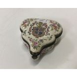 An 18th Century Lille pottery box and cover of leaf shape with all-over floral spray decoration,