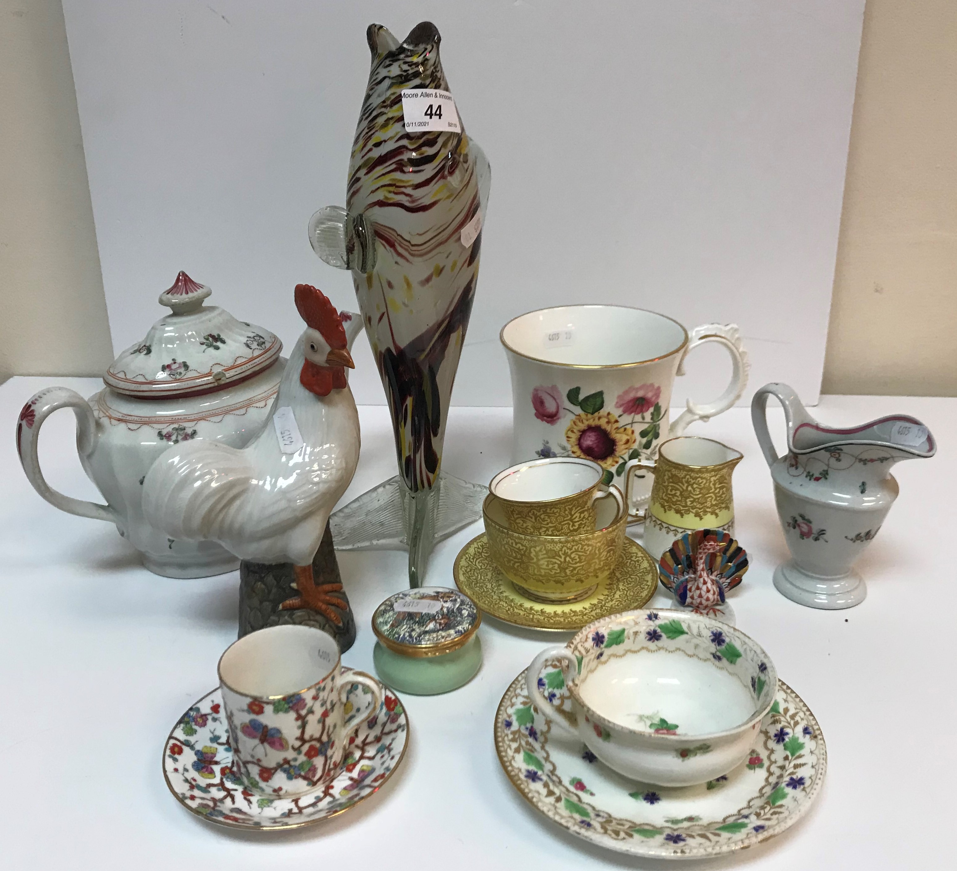 A collection of various china wares to include a Newhall style wrythen moulded teapot with floral