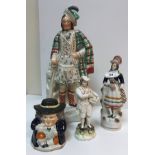 Eleven various 19th Century Staffordshire figures including Scotsman in formal kilt dress 38 cm