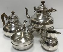 A silver four-piece tea set in the early Georgian style, comprising teapot, spirit kettle,