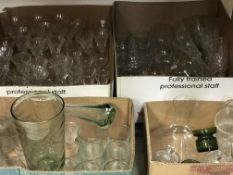 Four boxes of various glassware to include cut glass trumpet shaped wines, champagne saucers,