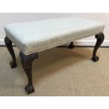 An early to mid 20th Century upholstered stool,