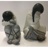 Two Lladro figures of "Seated children", one with crossed legs and head resting upon arms,