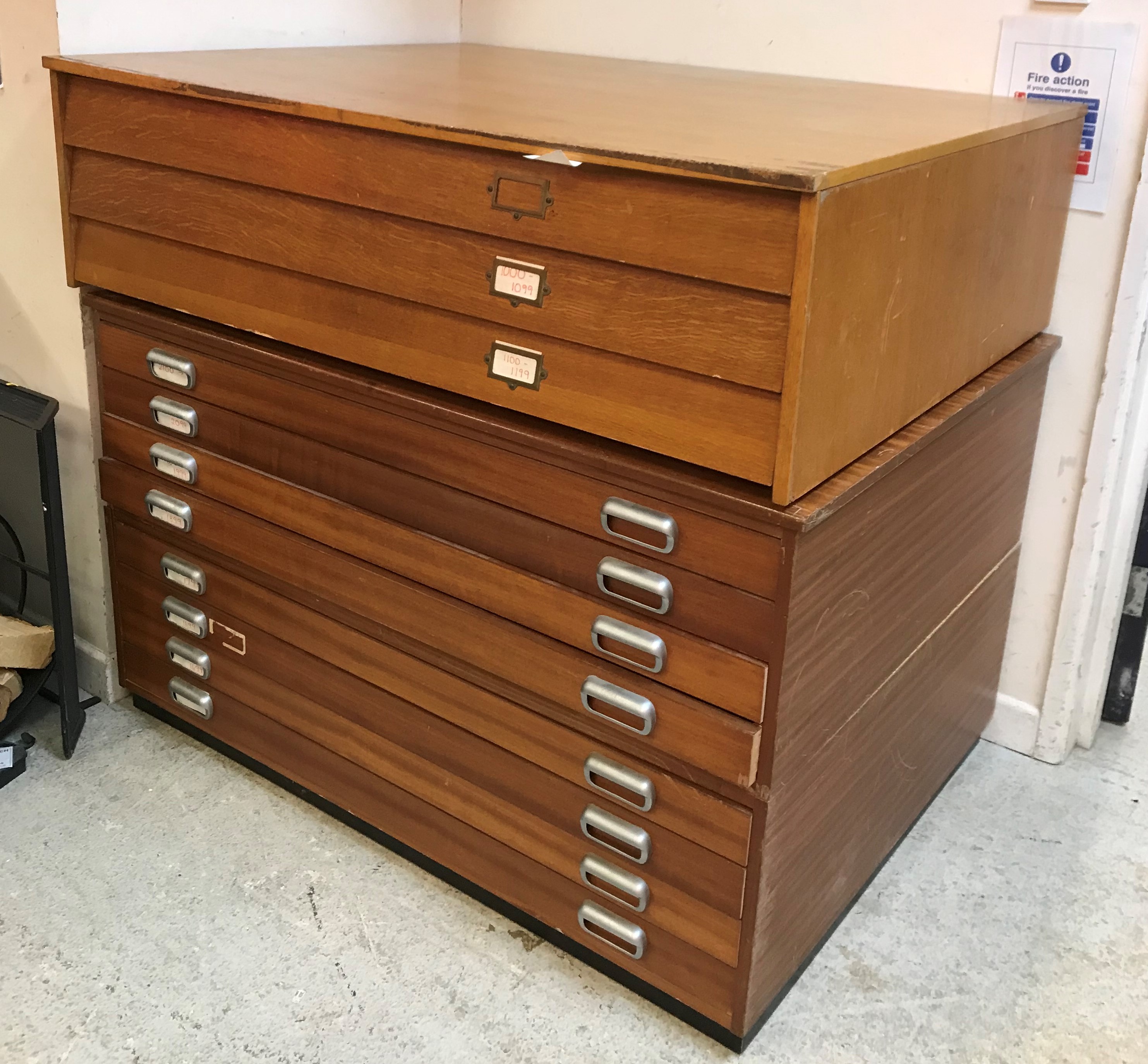 A mid 20th Century two section eight drawer plan chest containing various maps,