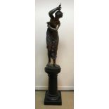 A 19th Century French patinated bronze figure of Ondine inscribed to the circular base "Ondine 1874