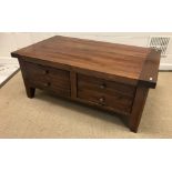 A 20th Century Eastern hardwood coffee table chest, the plain top above two deep drawers,