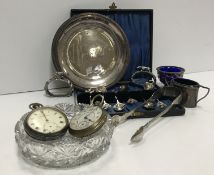 A collection of silver wares to include a cased set of six coffee spoons with "Thistle" set finials,