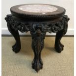 A late 19th Century Chinese urn stand,
