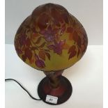 A 20th Century cameo glass lamp in the manner of Gallé with all over floral decoration in red on a