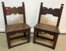 A pair of 19th Century Continental panel seated chairs with carved dentil detail,