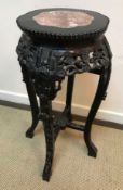 A circa 1900 Chinese rosewood urn stand,