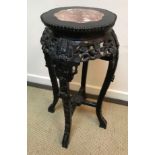 A circa 1900 Chinese rosewood urn stand,