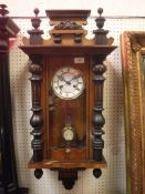 An early 20th Century Vienna regulator type wall clock with white enamel dial