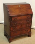 An Edwardian mahogany bureau of small proportions,