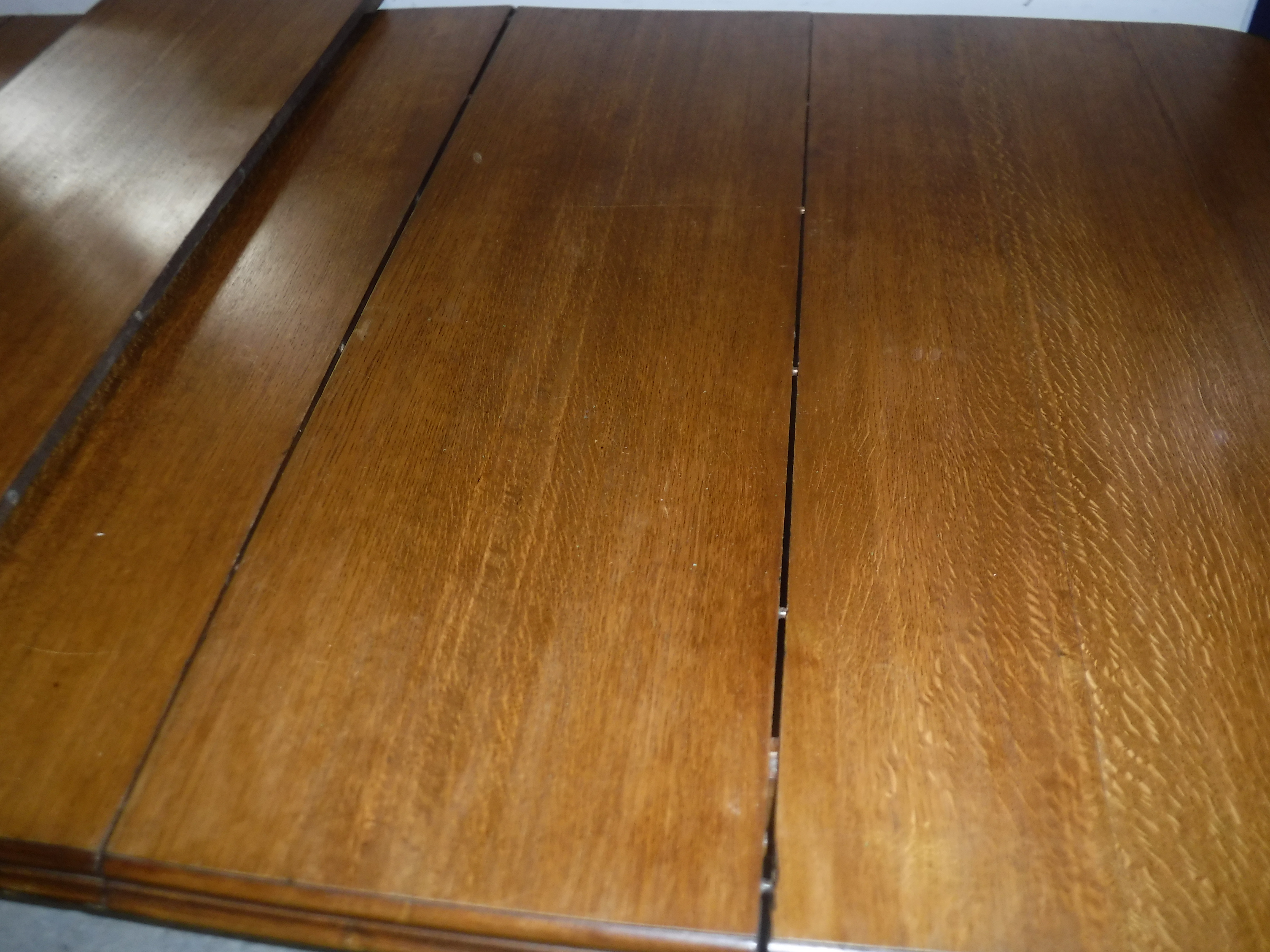 A Victorian oak shallow D end extending dining table with three extra leaves and moulded edge, - Image 4 of 20