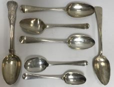 A collection of seven early 18th Century and later tablespoons to include a George II example with