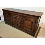 An 18th Century oak enclosed dresser,