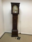 An 18th Century walnut cased long case clock, the eight day movement with silvered chapter ring,