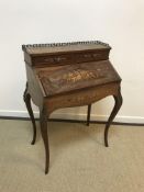 A circa 1900 French rosewood and marquetry inlaid bureau de dame with fitted interior and well over