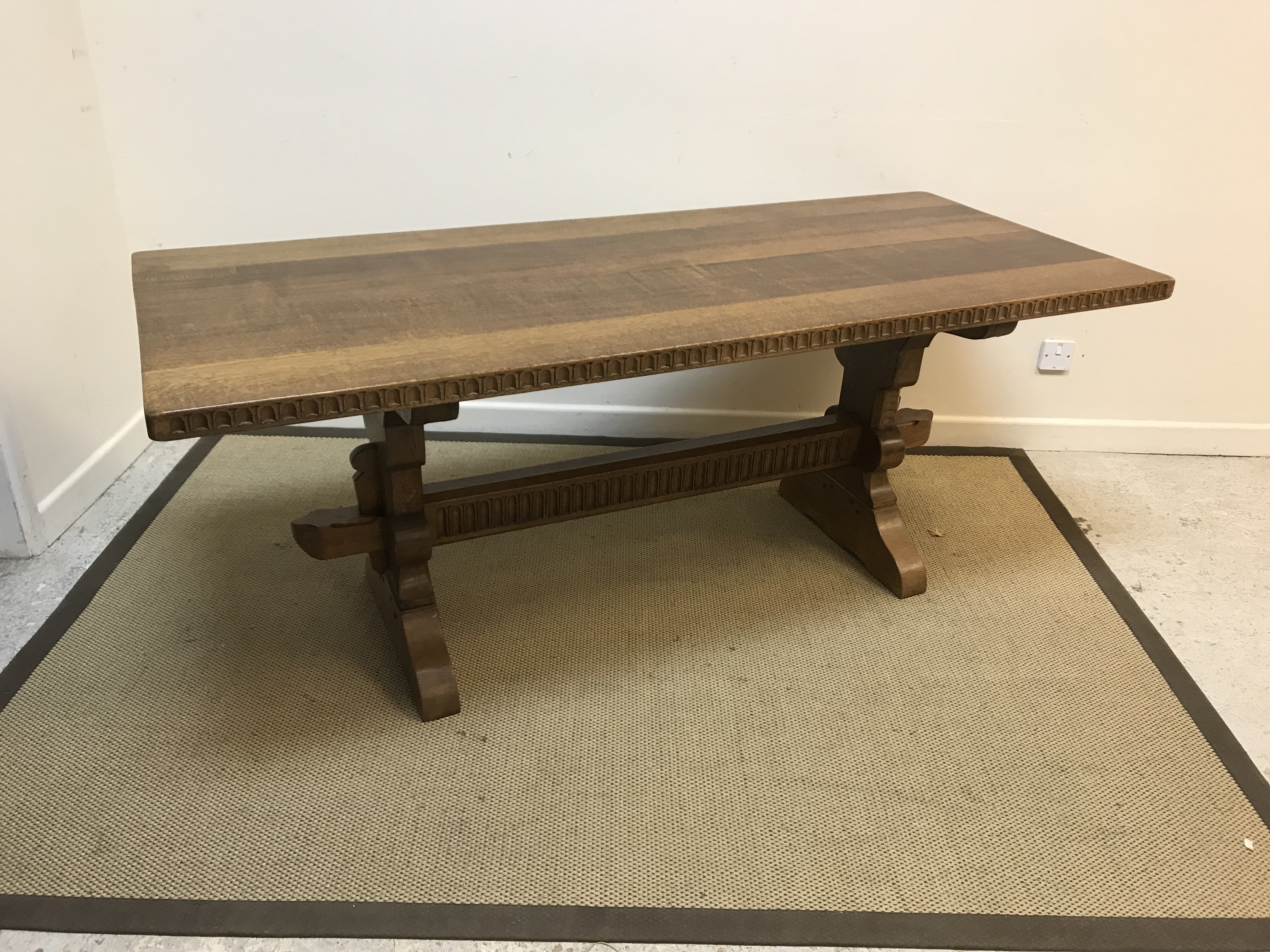 An oak refectory style dining table with notch carved edge on end pillar supports united by a - Image 2 of 2