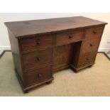 An early 19th Century mahogany kneehole desk,
