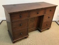 An early 19th Century mahogany kneehole desk,