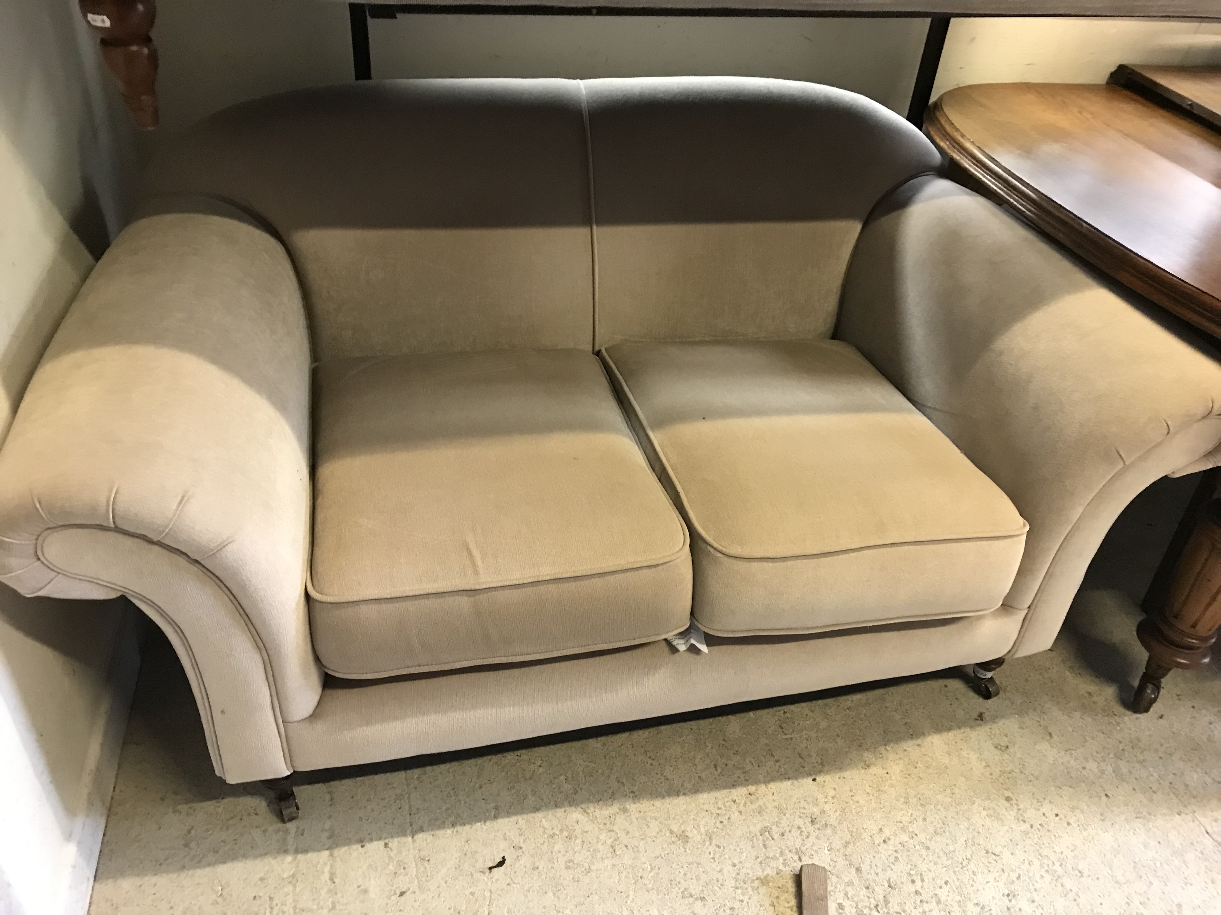 A modern fawn upholstered two seat sofa in the Victorian manner with scroll arms on turned legs to - Image 4 of 6