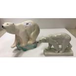 A Wedgwood figure of a polar bear upon a green tinged ice flow base 21 cm long x 16.