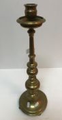 An early 20th Century brass candlestick in the 18th Century manner,