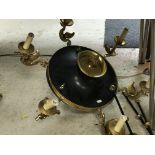 A brass and black painted metal six branch electrolier in the Empire style with swan decoration on