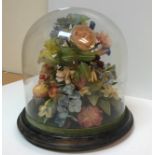 A late Victorian wax floral display including various wild flowers, strawberries,