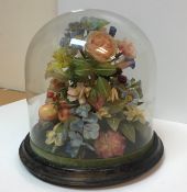 A late Victorian wax floral display including various wild flowers, strawberries,