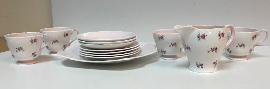 A Shelley "Charm" floral spray decorated pink ground part tea set comprising cream jug, four cups,