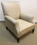 A circa 1900 upholstered scroll armchair on square tapered legs,