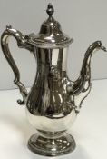 A George III silver coffee pot of pear shape,