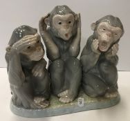 A Lladro figure group of three monkeys "Monkey Business", "See no evil, Hear no evil,