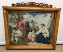 A Victorian maple veneered framed needlework tapestry of "Christ blessing children" (with old