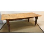 A circa 1900 pine farmhouse style kitchen table on turned and ringed legs,