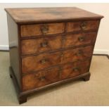 An 18th Century walnut chest,